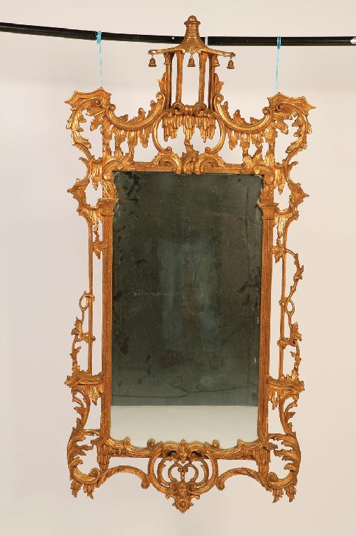 Appraisal: A PAIR OF CHIPPENDALE REVIVAL GILTWOOD WALL MIRRORS in the