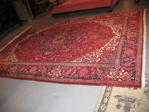 Appraisal: MODERN HERIZ STYLE RED AND BLUE RUG ft x ft