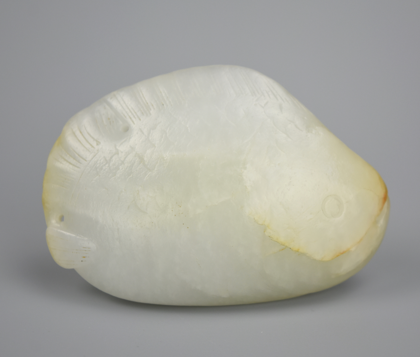 Appraisal: CHINESE HETIAN WHITE JADE FISH PENDANT A White hetian jade