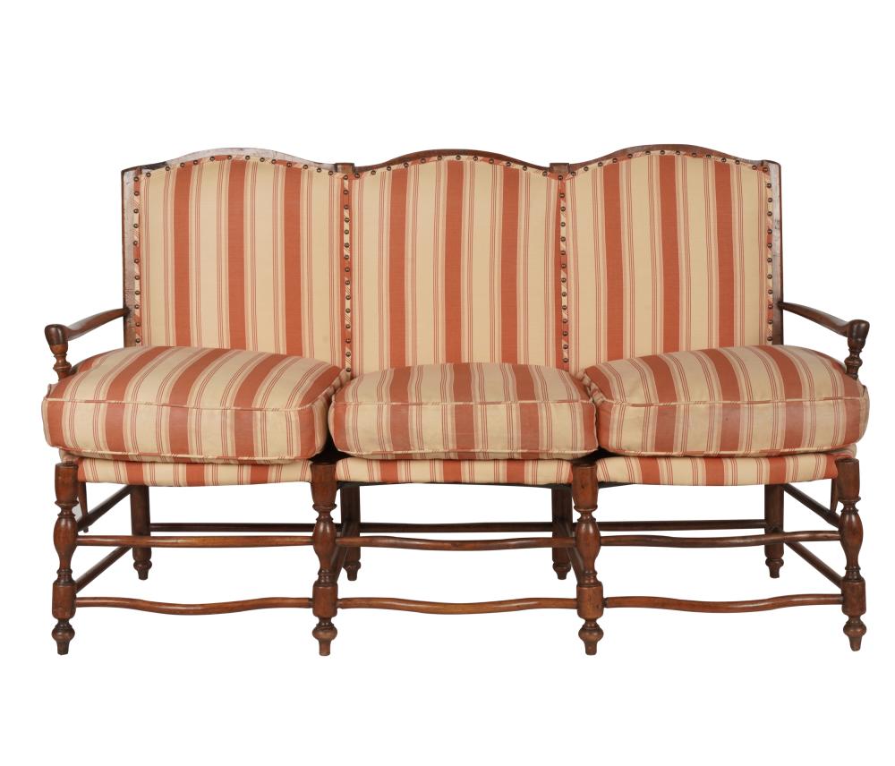 Appraisal: FRENCH PROVINCIAL-STYLE UPHOLSTERED SETTEEfruitwood frame red and cream striped fabric