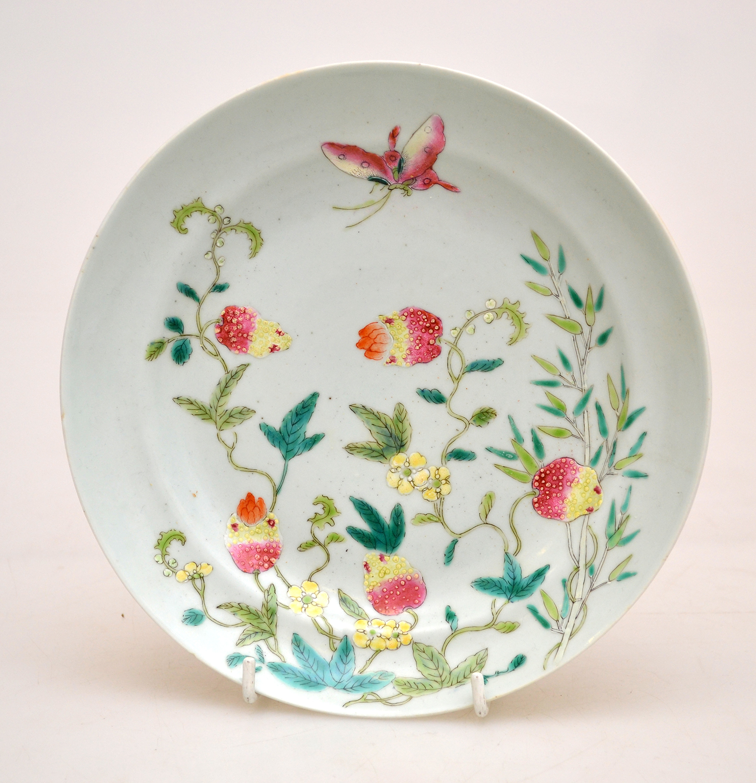 Appraisal: A MODERN EXPORT STYLE FAMILLE ROSE ENAMELLED PLATE modelled in