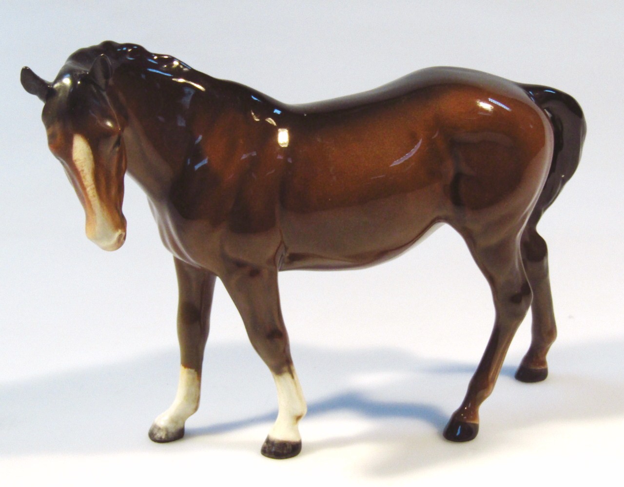 Appraisal: A Beswick standing horse brown colourway head left white front