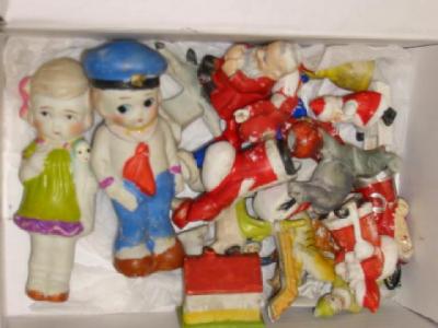 Appraisal: Approximately twenty five bisque cake decorations including Father Christmas animals