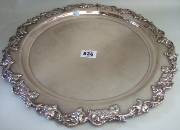 Appraisal: A plated shaped circular salver the rim decorated with a