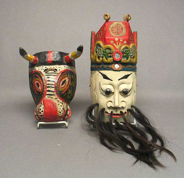 Appraisal: A Chinese ceremonial painted wood theatrical mask Possibly representing the