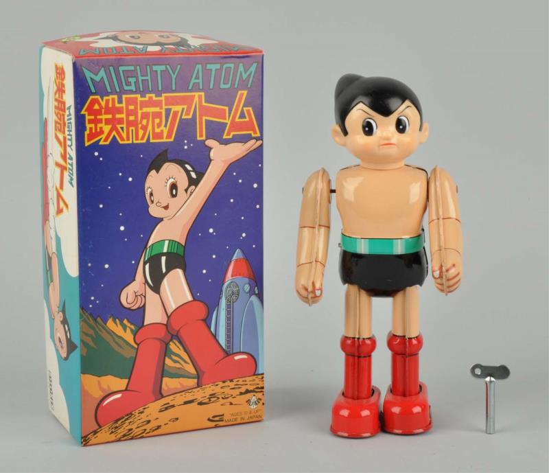 Appraisal: Japanese Tin Litho Wind-Up Mighty Atom Boy In original box