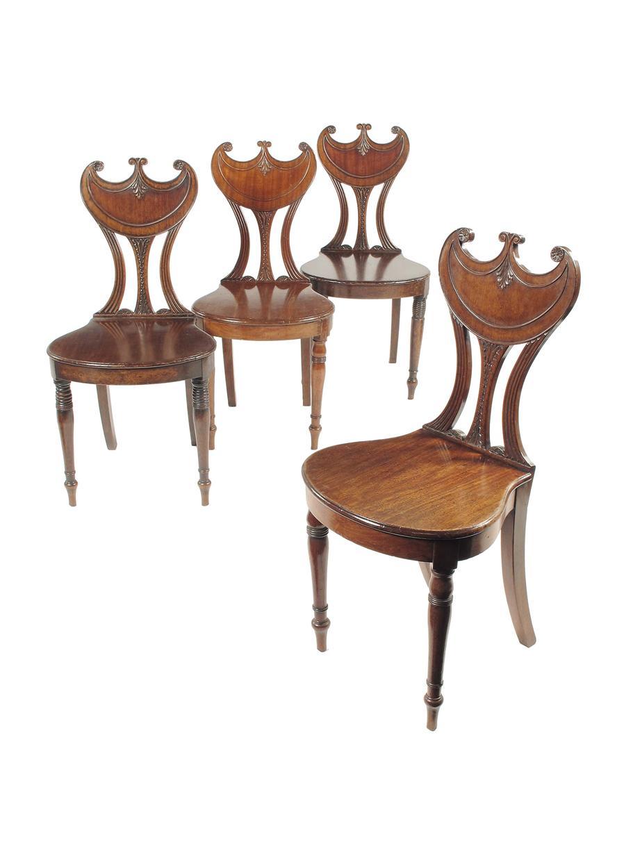 Appraisal: A matched set of four late Regency mahogany hall chairs