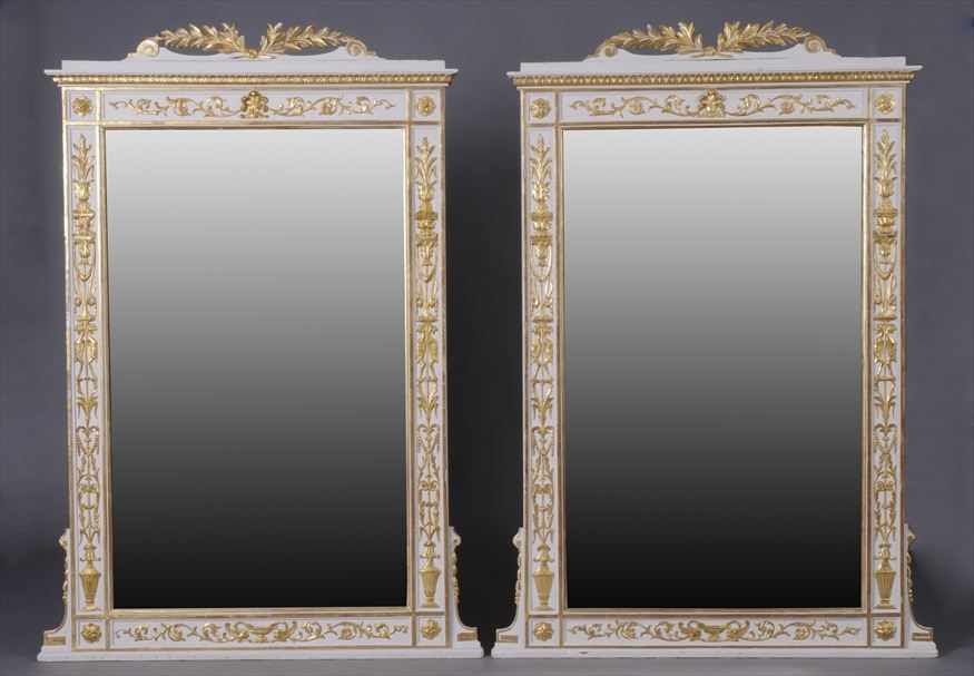 Appraisal: PAIR OF ITALIAN NEOCLASSICAL CARVED WHITE-PAINTED AND PARCEL-GILT MIRRORS Each