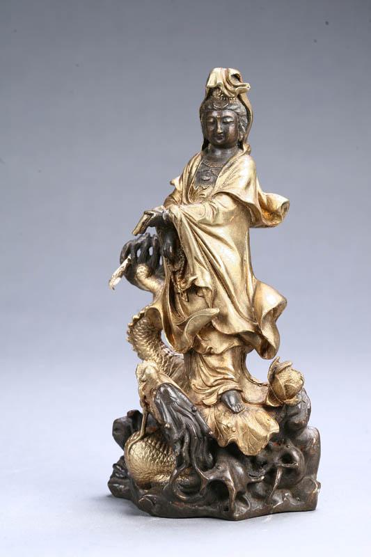 Appraisal: STATUE OF A FIGURE STANDING ON A DRAGON Asian late