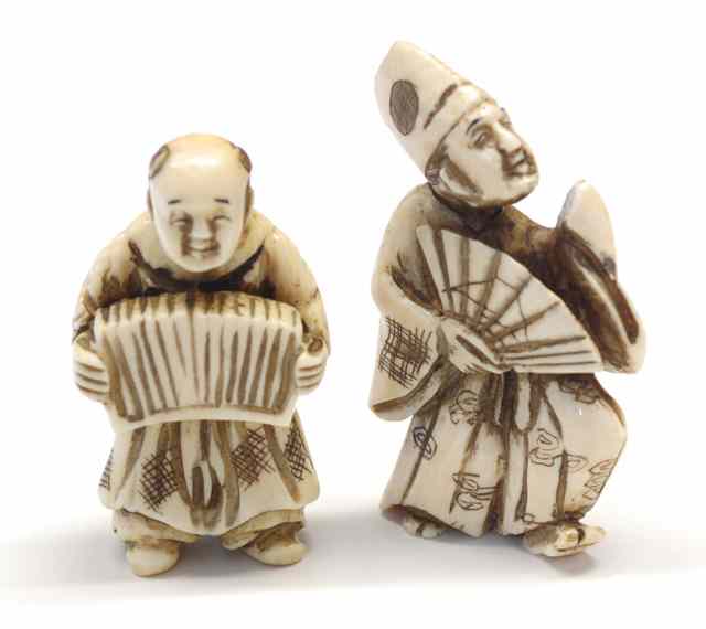 Appraisal: TWO IVORY CARVED NETSUKE man in profile holding fan ''