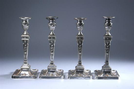 Appraisal: FOUR SILVER PLATED ADAM-STYLE CANDLESTICKS th century - in tall