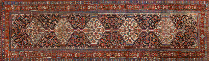 Appraisal: PERSIAN RUNNER Worked with five ivory-ground conjoined hexagons on a