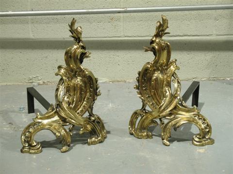 Appraisal: LOUIS XV STYLE BRASS ANDIRONS Formed as interlocking c-scrolls -