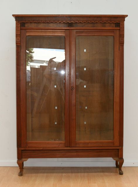 Appraisal: A Northern Italian style walnut and oak display cabinet the