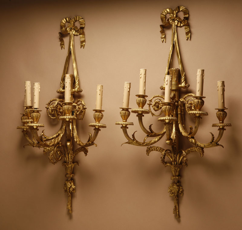 Appraisal: A pair of Louis XVI style ormolu five-branch wall lights