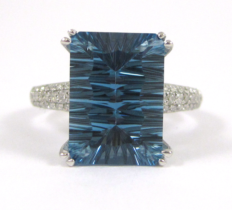 Appraisal: LONDON BLUE TOPAZ AND DIAMOND RING The k white gold