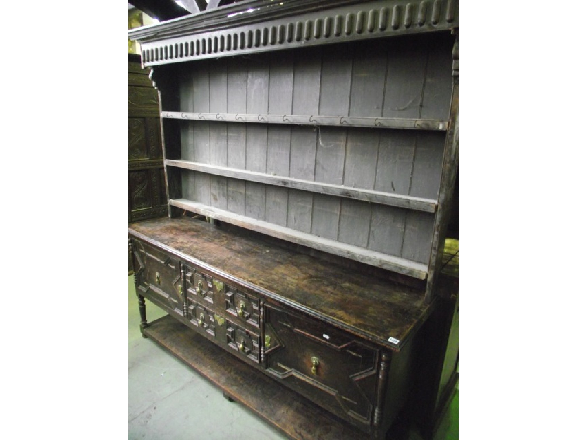 Appraisal: A Jacobean revival oak dresser the base enclosed by a