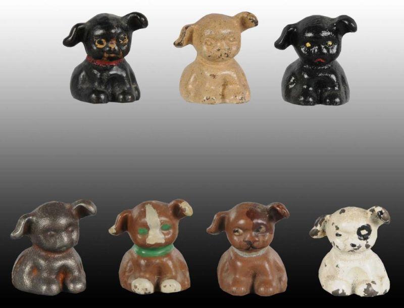 Appraisal: Lot of Puppo Dog Cast Iron Paperweights Description Assorted paint