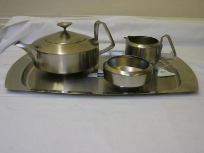 Appraisal: A THREE PIECE STAINLESS STEEL TEA SERVICE by Robert Welch