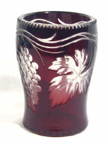 Appraisal: A Bohemian ruby glass overlay vase depicting grapes on a