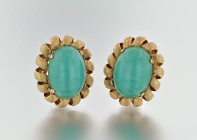 Appraisal: A Pair of Turquoise and Gold Earclips Turquoise cabochons measuring