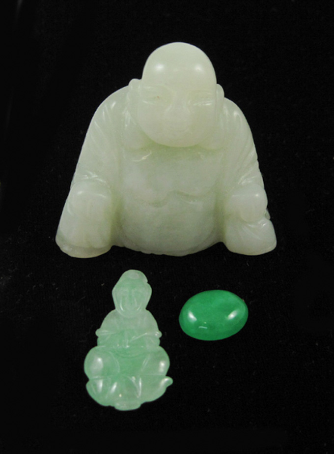 Appraisal: THREE ARTICLES OF GREEN JADE including a light green jade