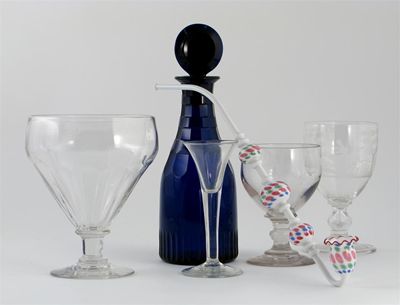 Appraisal: A blue glass decanter and stopper with faceted neck and