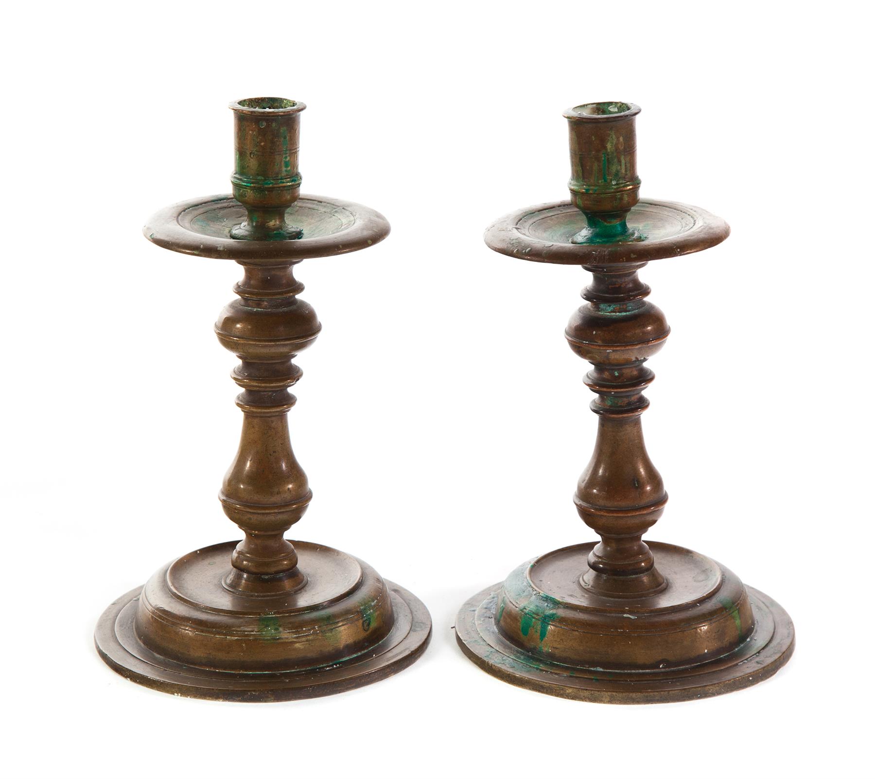 Appraisal: PAIR OF SPANISH BRASS CANDLESTICKS Seventeenth century Bulbous stem on