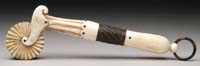 Appraisal: OUTSTANDING EARLY IVORY AND BALEEN JAGGING WHEEL The fancy handle