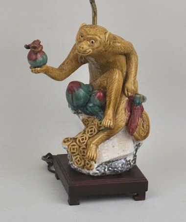 Appraisal: Asian Porcelain Monkey Lamp with repair to outstretched arm high