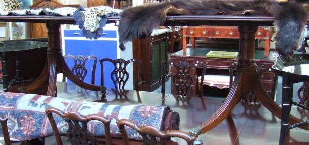 Appraisal: A mahogany D end twin pedestal extending dining table in