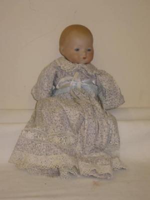 Appraisal: An Armand Marseille bisque head baby doll with blue glass