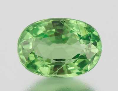 Appraisal: An Unmounted Tsavorite Garnet Carat Oval faceted cut weighting ct