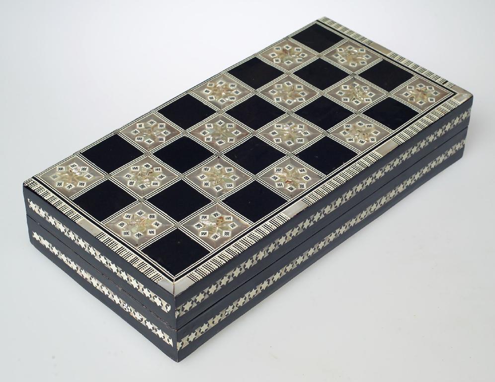 Appraisal: EBONISED BONE AND MOTHER-OF-PEARL INLAID GAMES BOX decorated with bands