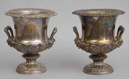 Appraisal: PAIR OF ENGLISH ARMORIAL SILVER-PLATED WINE COOLERS Impressed hand mark