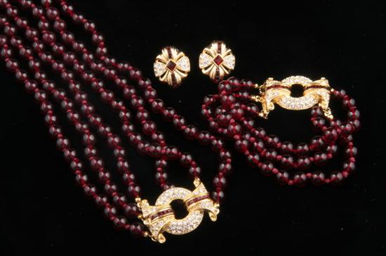 Appraisal: SIGNED NOLAN MILLER TRIPLE-STRAND GARNET BEAD NECKLACE With gild and