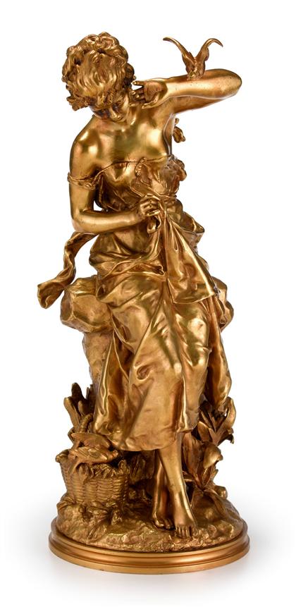 Appraisal: French gilt bronze figure of a girl with a bird