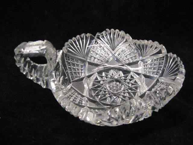 Appraisal: Cut Glass Handled Nappy brilliant period triangular with fold in