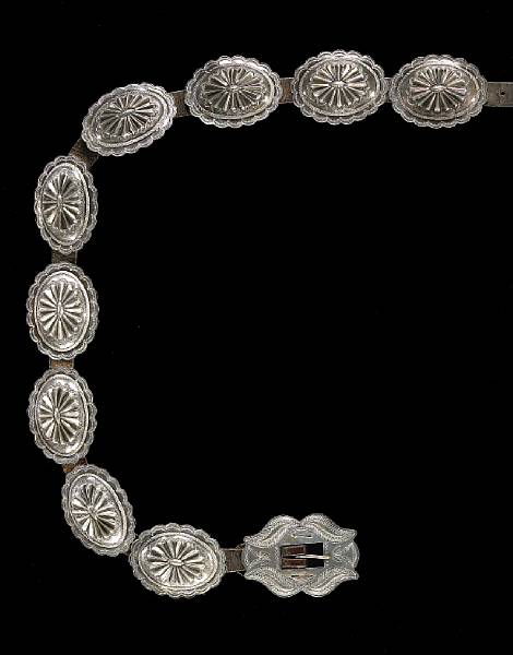 Appraisal: A Navajo concha belt Consisting of nine scalloped repousse silver