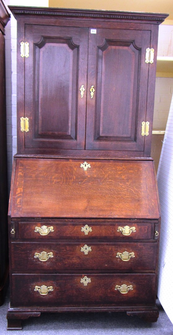 Appraisal: A George II oak bureau bookcase with a pair of