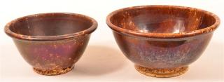 Appraisal: Two Rockingham Yellowware Mixing Bowls Two Rockingham Glazed Yellowware Mixing