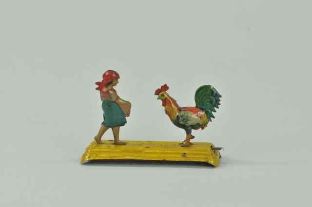 Appraisal: GIRL FEEDING CHICKEN MECHANICAL PENNY TOY Meier depressing lever causes