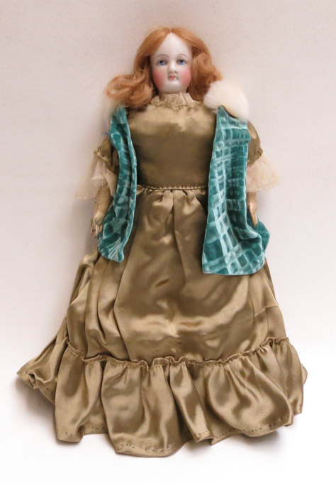 Appraisal: A CONTINENTAL BISQUE HEAD DOLL with blonde hair and painted