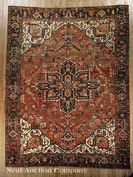 Appraisal: A Persian Heriz Carpet red and camel ground segmented central