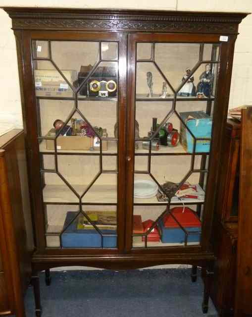 Appraisal: AN EDWARDIAN MAHOGANY DISPLAY CABINET with blind fretwork decoration the