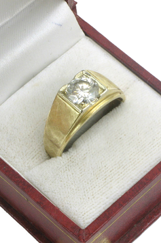 Appraisal: MAN'S DIAMOND AND FOURTEEN KARAT GOLD RING centering a round