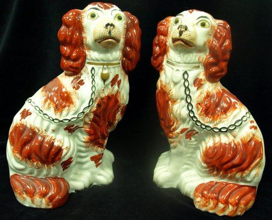 Appraisal: A pair of Staffordshire liver and white dogs cm high