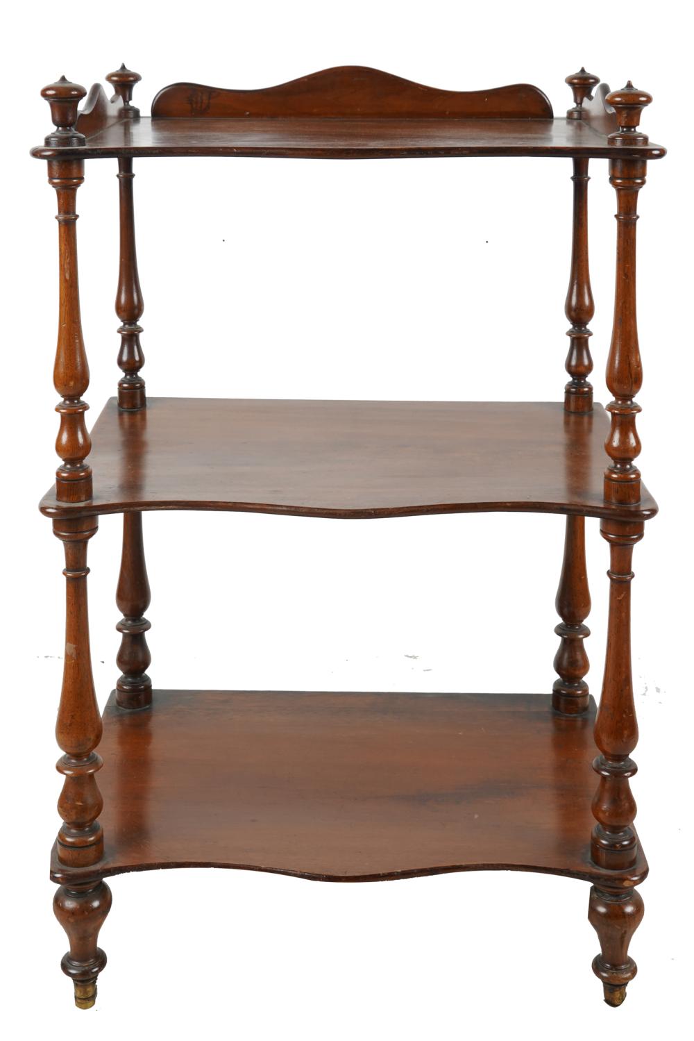 Appraisal: VICTORIAN MAHOGANY WHATNOT ETAGEREhaving three tiers on baluster-turned supports inches