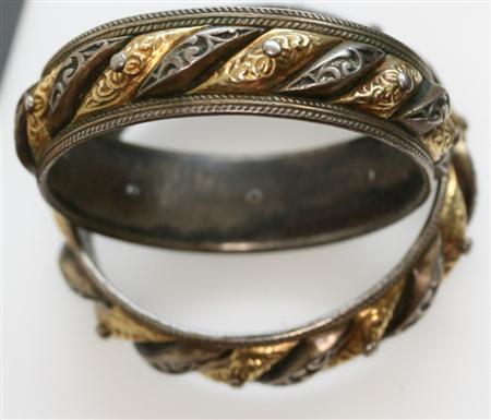 Appraisal: Two th century bangles possibly African with alternating white and