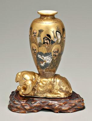 Appraisal: Satsuma elephant the reclining caparisoned beast bearing a vase with